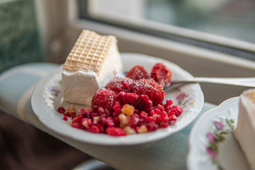 Berries and ice-cream on a plate