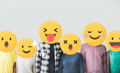 Diverse friends with positive emoticons