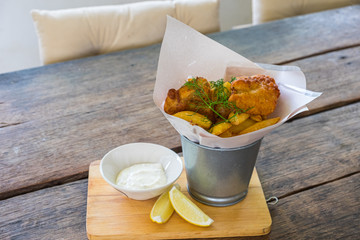 Fried chicken wings on wooden table. Breaded Crispy fried kentucky chicken tasty dinner