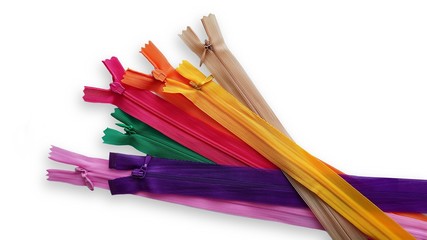 Group of isolated colorful zippers on white background. Pink, purple, yellow, orange, green, beige zippers.