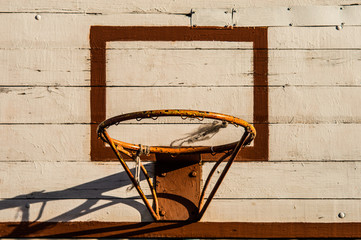 Old basketball hoop with a wooden board