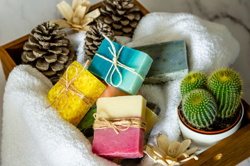 Spa box with organic handmade soap bars with white marble background.