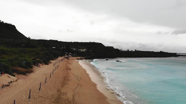 A high view of empty Kenting Baishawan beach with beautiful turquoise water, White Sand Bay, Hengchun Peninsula of Pingtung County, Taiwan. Drone 4k aerial shot.