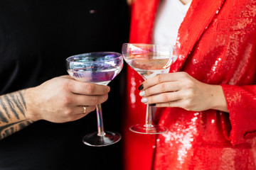 Couple making a toast with cocktails