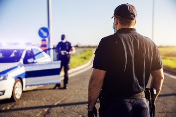 Police officer emergency service car driving street. Siren light