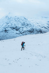 Fototapeta na wymiar Hiking at a snowy Glen Coe