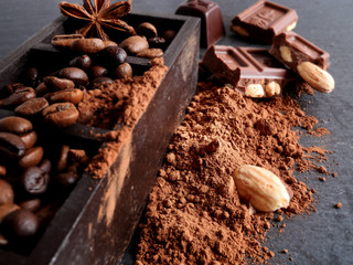 coffee beans, anise star, chocolate, nuts and cocoa powder, spices