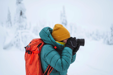Landscape photographer capturing a snowy Lapland