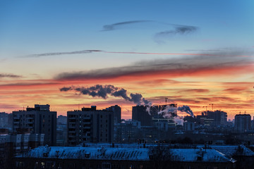 Winter city landscape at sunset