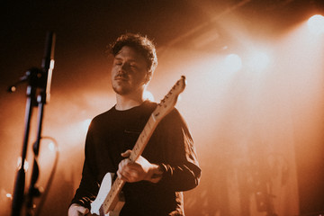 Guitarist playing electric guitar in a rock concert