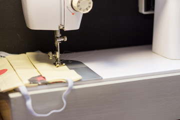 Sewing masks for protection against the virus. Self-isolation at home