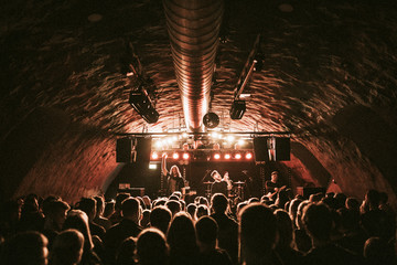 Rock band playing a concert at a live house in Europe