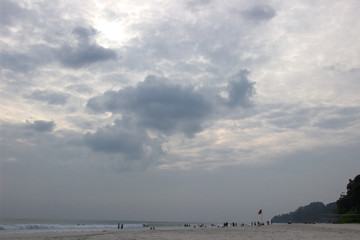 A shot of sandy beach and dramatic evening sky