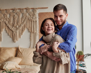 romantic happy young couple relax at modern home indoors