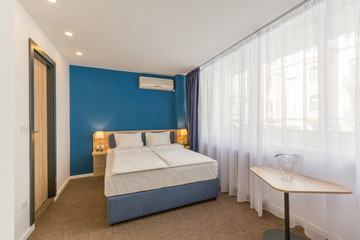Naklejka na ściany i meble Interior of a double bed hotel room interior