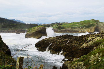 waves crashing on rocks