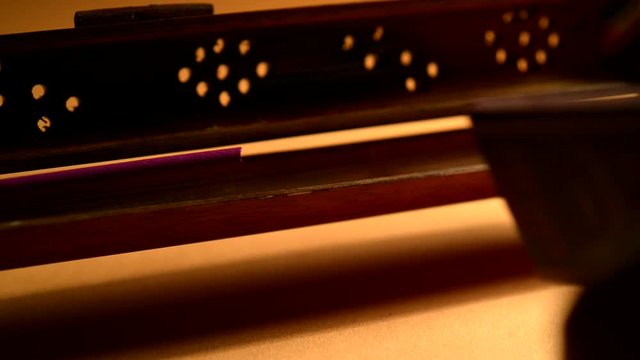 Burning incense stick in bamboo holder