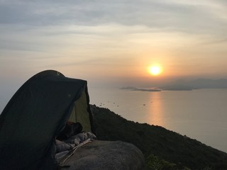 Naklejka na ściany i meble Sunset camping on Island