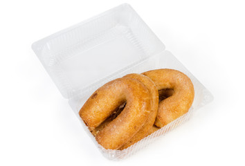 Cheese rolls in a horseshoe form in open plastic container