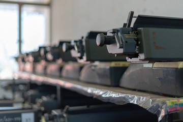 Close up photo of vintage manual typewriter being fixed by a repairman
