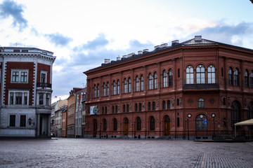 Fototapeta premium Beautiful Riga city architecture with old buildings and brick streets.