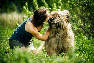girl with a big shaggy dog in nature