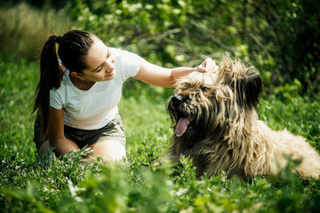 girl with a big shaggy dog in nature