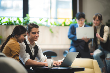 Business coworkers discussing new ideas and brainstorming in a modern office