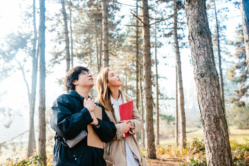Naklejka premium Scientists are studying plant species in the forest. Scientist ecologist inspect trees
