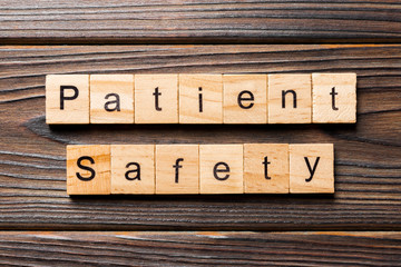 Patient Safety word written on wood block. Patient Safety text on wooden table for your desing, concept
