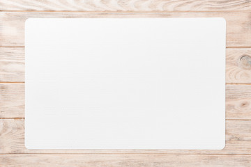 Top view of white table napkin on wooden background. Place mat with empty space for your design - Powered by Adobe