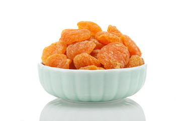 Dried yellow peach fruit on a white background