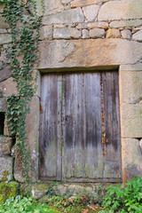 A door of a ruined house on the banks of the river Sil, Ourense province, Spain