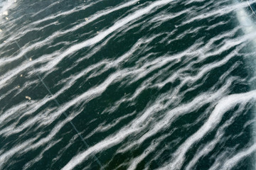 Fototapeta premium Striped ice on lake Baukal closeup