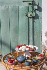 table with a snack of sweets and fruits