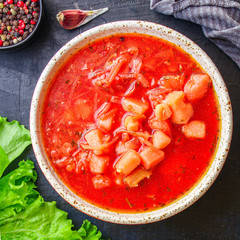 red tomato soup and vegetables and meat, borsch cuisine menu concept keto or paleo diet background. top view. copy space for text