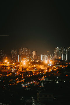 Urban night skyline panoramic view of Ho Chi Minh city. Ho Chi Minh City with development buildings, transportation, energy power infrastructure. View from District 7, Saigon. High resolution 