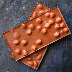 chocolate bar hazelnuts and almonds
(delicious sweet dessert snack) keto or paleo diet menu concept. background. top view. copy space for text 