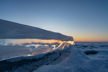 The rising sun through the ice