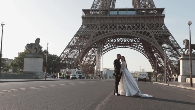 brides are photographed on the background of the elf tower. June. Paris