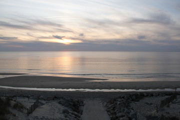 Fototapeta na wymiar sunset on sand beach in Lacanau ocean France