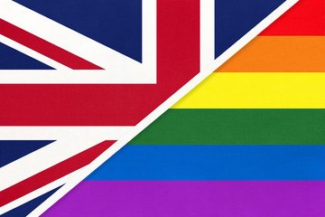 United Kingdom of Great Britain and Ireland vs rainbow flag of LGBT community from textile opposite each other.