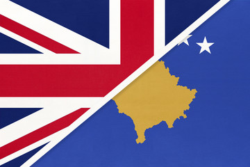 Fototapeta na wymiar United Kingdom vs Republic of Kosovo national flag from textile. Relationship between two european countries.