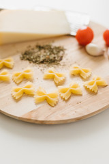 Variety of types and shapes of Italian pasta in rows on white background. Italian cuisine food. Dry pasta background texture.