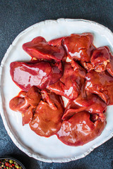  raw chicken liver
(healthy eating) keto or paleo diet menu concept background. top view. copy spaces for text