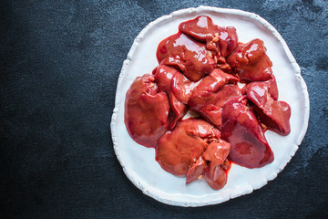  raw chicken liver
(healthy eating) keto or paleo diet menu concept background. top view. copy spaces for text