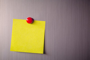 Empty paper sheet on refrigerator door with magnetic clip paper note for add text message.