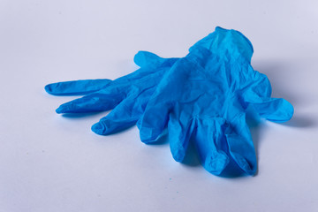 
blue medical gloves on a white background