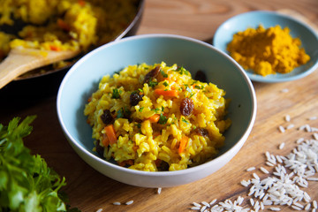 Yellow curry rice with vegetables and raisins