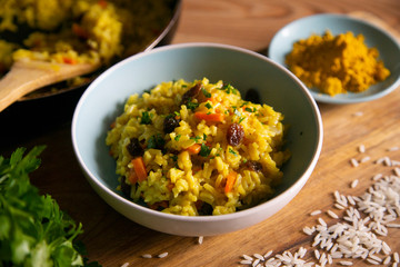 Yellow curry rice with vegetables and raisins
